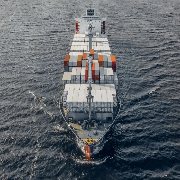 a fully loaded container ship at sea