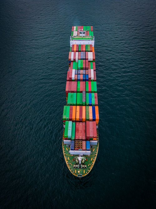 a fully loaded container ship at sea