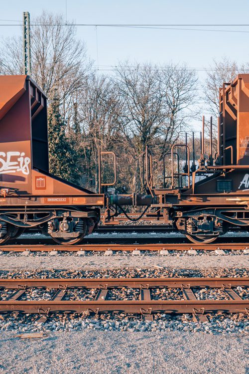 A Cargo train on railways on a sunny day