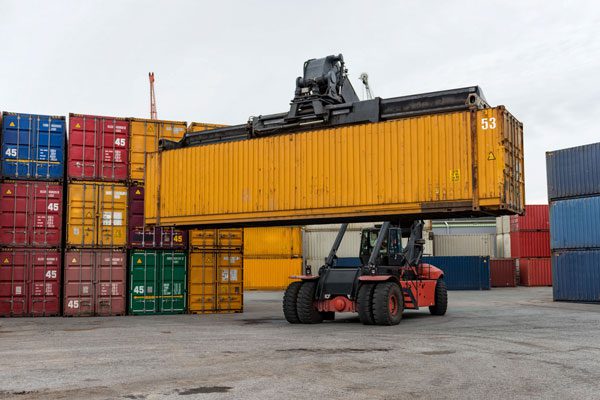 mobile stacker lifting a 53 foot container